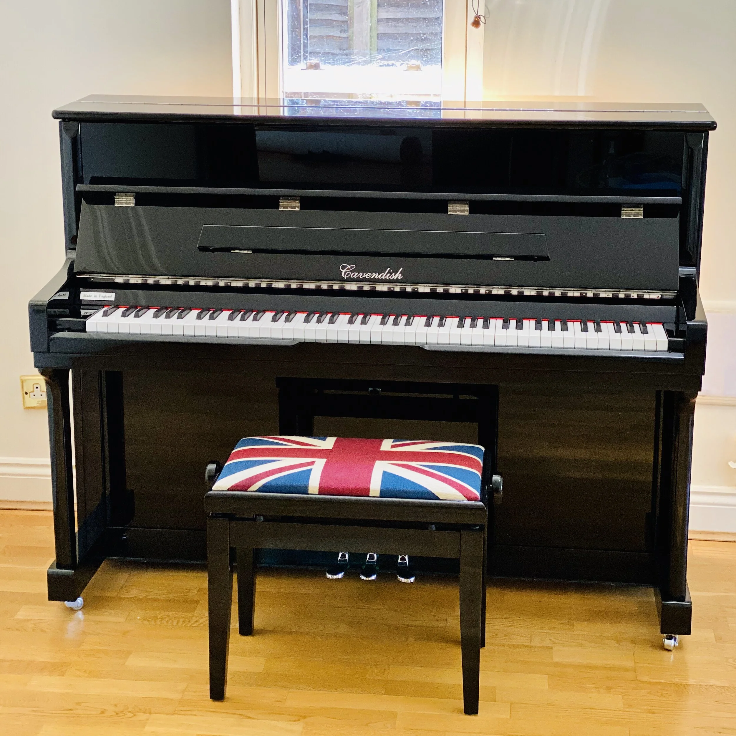 Upright piano wrapped and protected, ready to go into storage